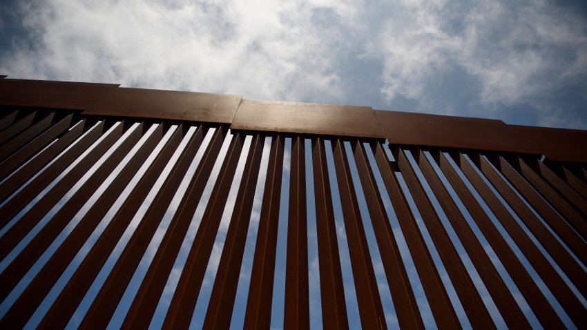 New sections of the steel bollard-style border wall stand along the US-Mexico border between San Diego and Tijuana on May 10, 2021, in the Otay Mesa area of San Diego County, California. – Few issues have as long a history of bedeviling both Democrats and Republicans as immigration and asylum on the approximately 2,000-mile (3,000-kilometer) US-Mexico frontier. (Photo by Patrick T. FALLON / AFP) (Photo by PATRICK T. FALLON/AFP via Getty Images)