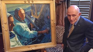 FILE – In this March 22, 2016, file photo, retired NASA astronaut Tom Stafford, a native of Weatherford, Okla.,, who flew the first lunar module to the moon in 1969, stands in front of a portrait made in his honor in the Oklahoma House of Representatives lounge in Oklahoma City.