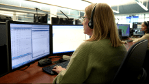 Dispatchers answer calls at the San Diego County Sheriff's Office.