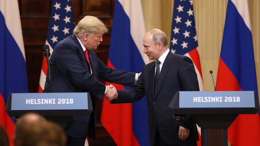 Trump and Putin shake hands