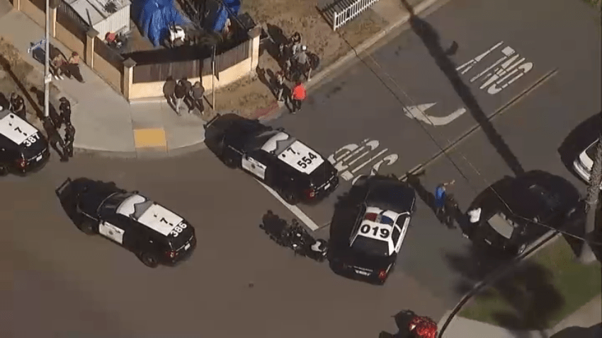 Patrol cars at the scene on Thursday afternoon near the Earl and Birdie Taylor Library in Pacific Beach.
